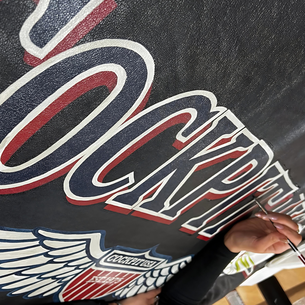 The Cockpit USA hand-painted Store Sign & Custom Jackets