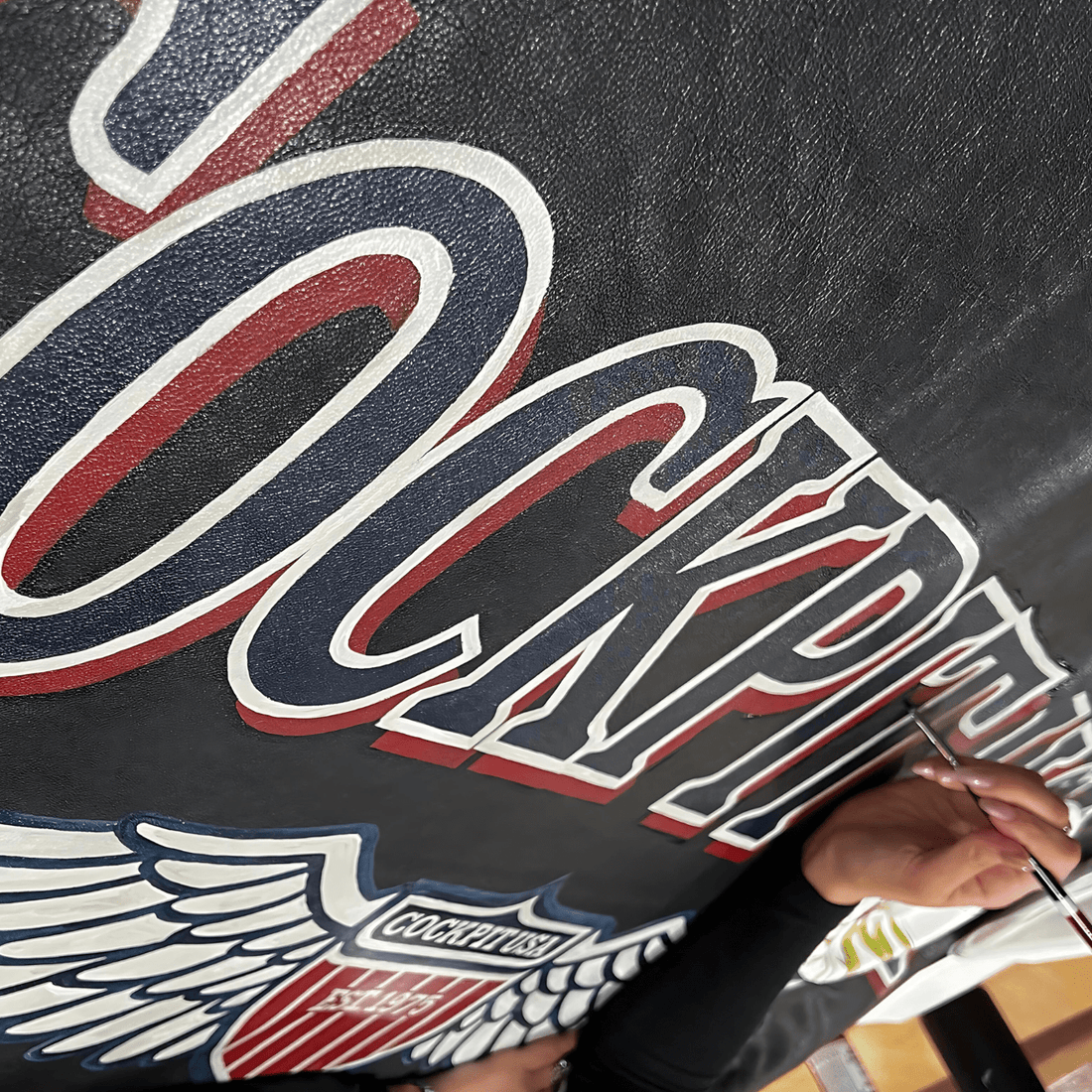 The Cockpit USA hand-painted Store Sign & Custom Jackets - Cockpit USA